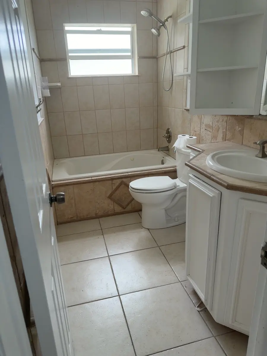 Bathroom: dated tile to modern spa - before