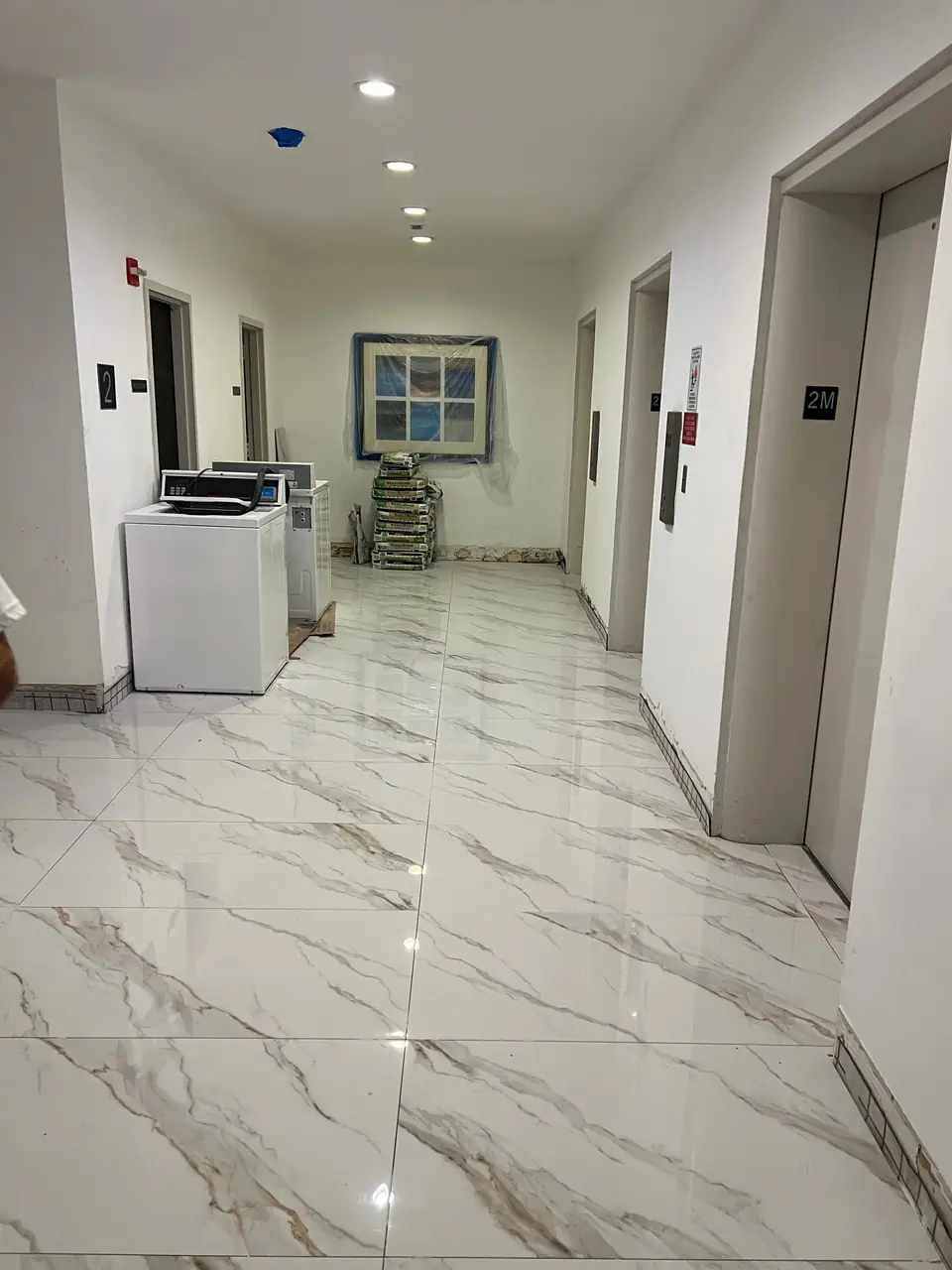 Large-format porcelain hallway tile - real Remodel Right FL project