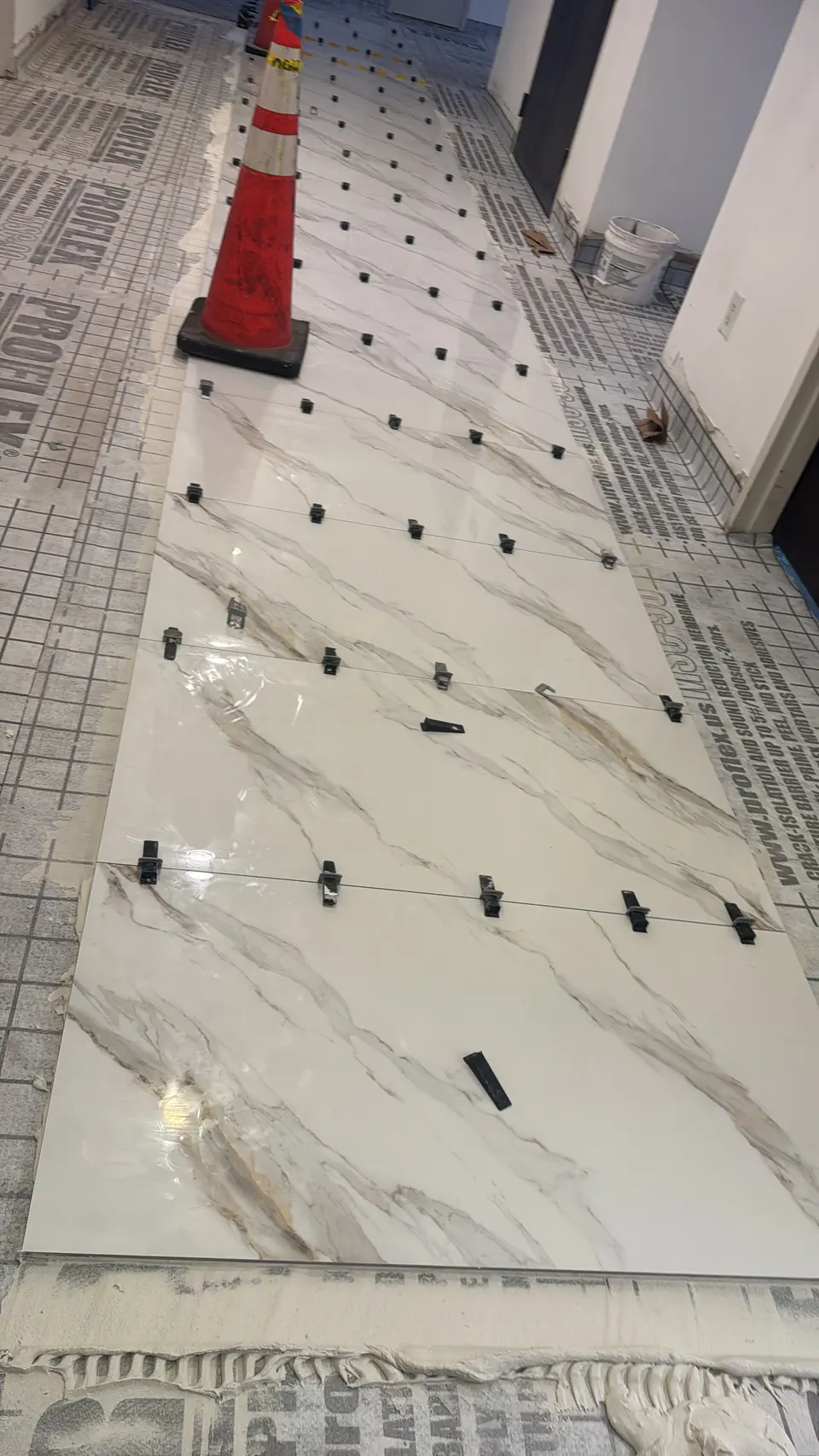 Hallway tile install - real Remodel Right FL project