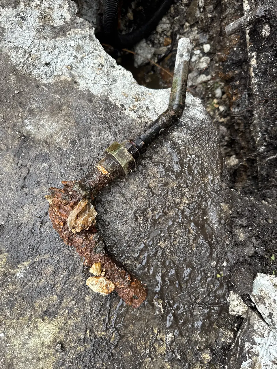 Rusted line found in trench (before) - real Remodel Right FL project